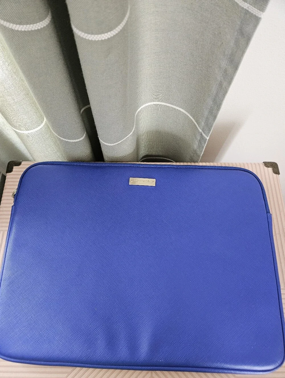 kate spade cobalt blue laptop sleeve with gold logo plaque